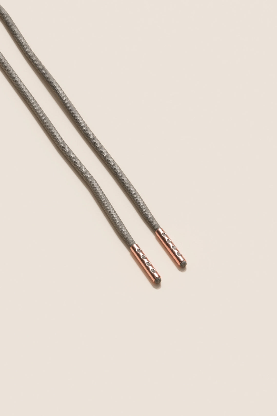 Senkels Graphite Grey 2.5mm Round Waxed Shoelaces with Rose Gold Aglets